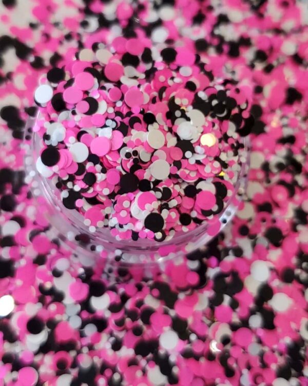 A close up of pink and black confetti