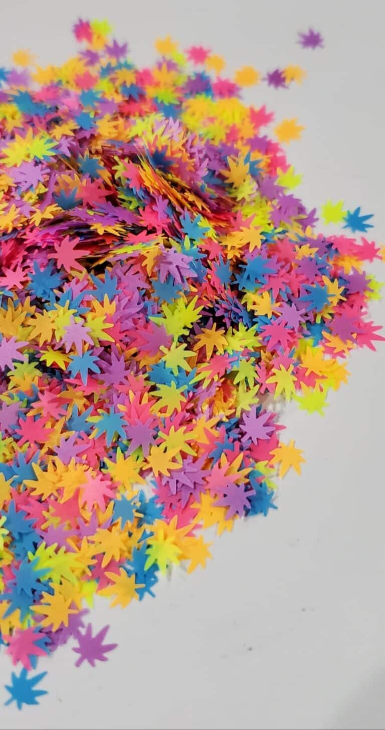 A pile of colorful confetti on top of the floor.