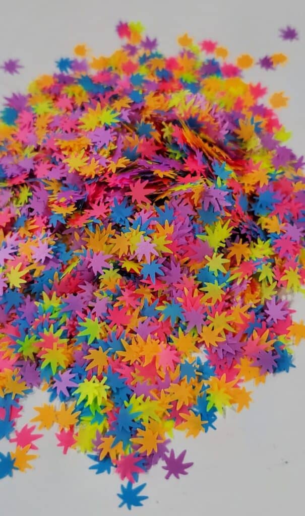 A pile of colorful confetti on top of the floor.