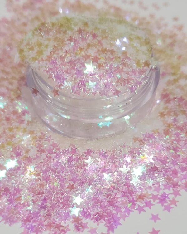 A bowl of pink and white stars on the table