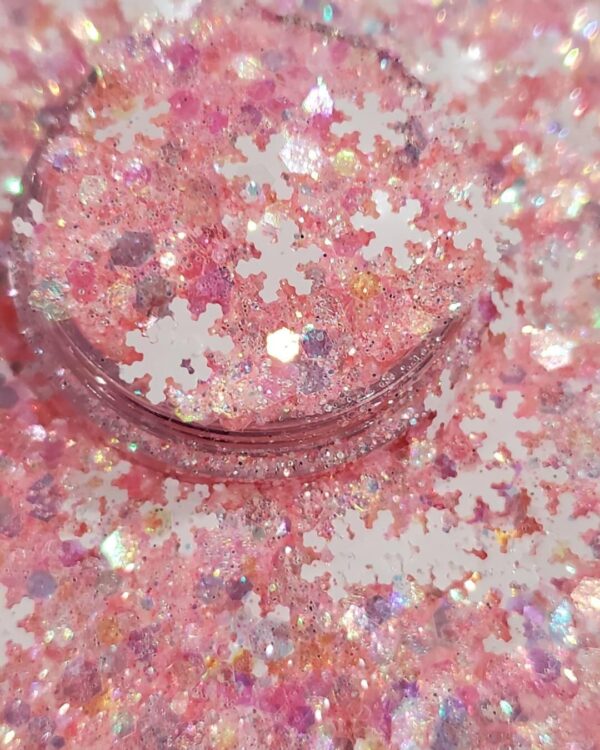 A pink and white snow flake shaped confetti.