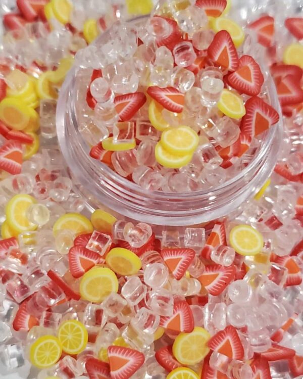 A bowl of candy is shown with yellow and red candies.