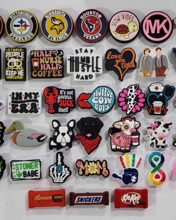 A bunch of different magnets that are on the wall