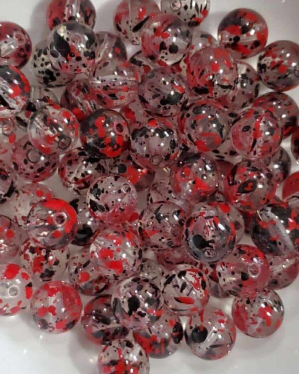 A close up of many red and black beads