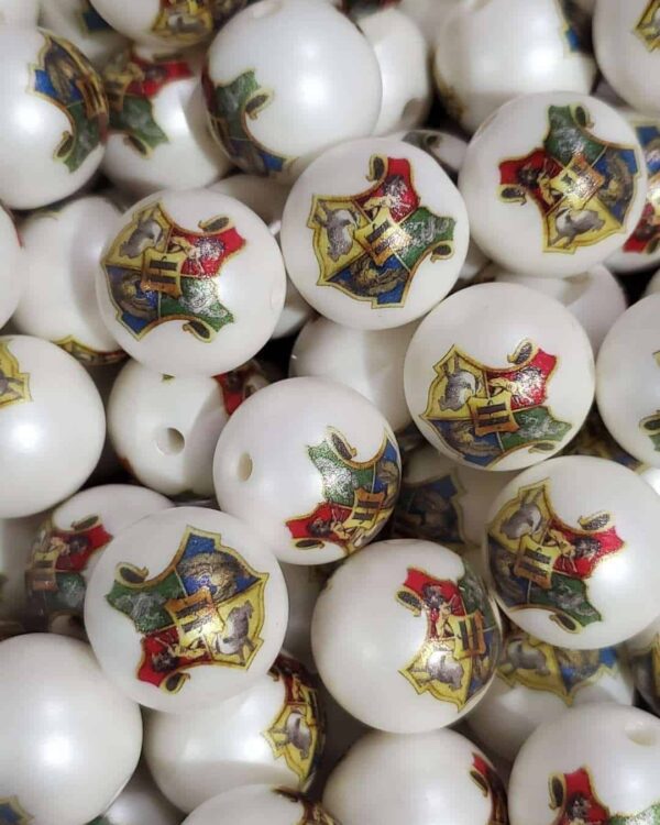 A pile of white beads with a picture on them.