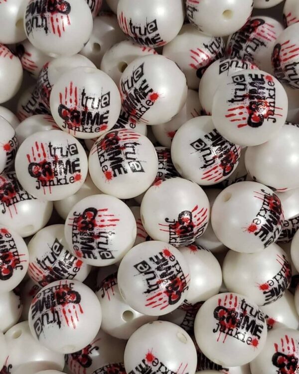 A pile of white balls with red and black lettering.