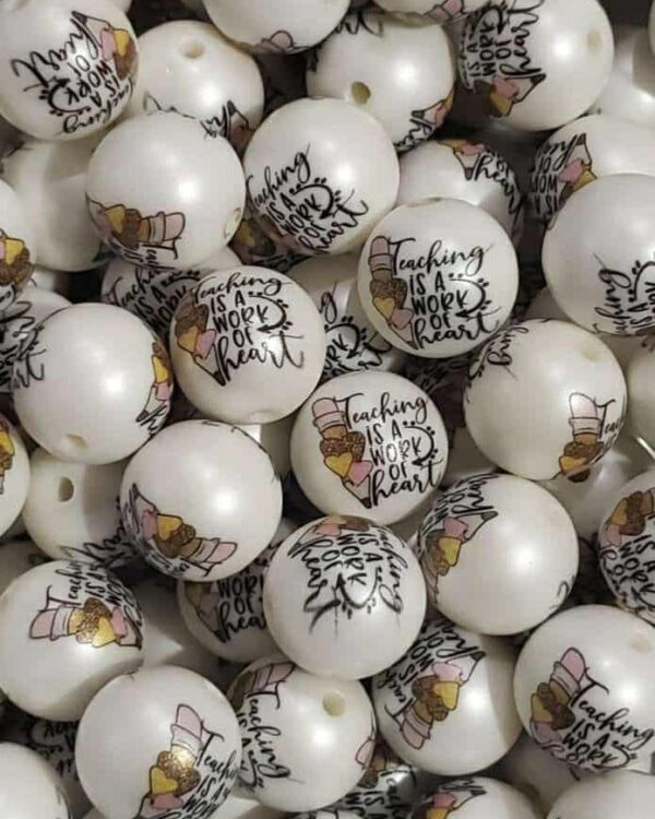 A pile of white balls with writing on them.