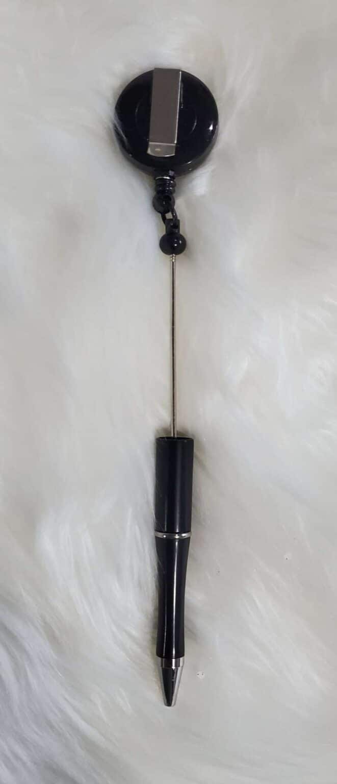 A black and silver object hanging on the wall